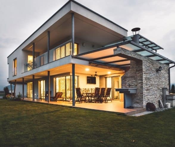 Modern house with outdoor patio, stylish architecture, and spacious living area.