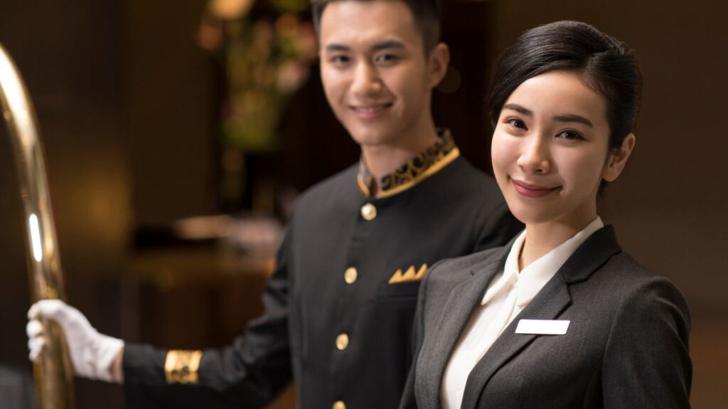 2 hotel staff smiling